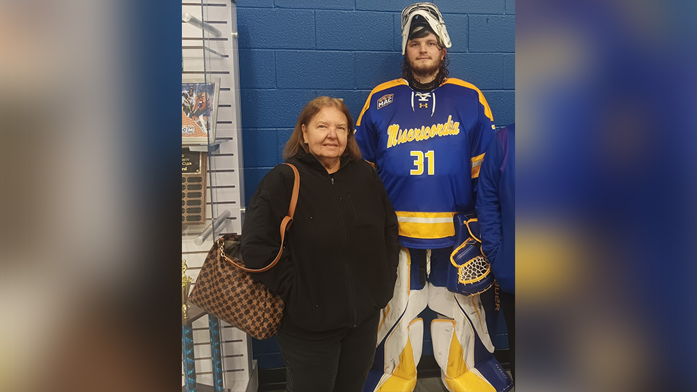 Suzanne Healey and her grandson in a hockey uniform