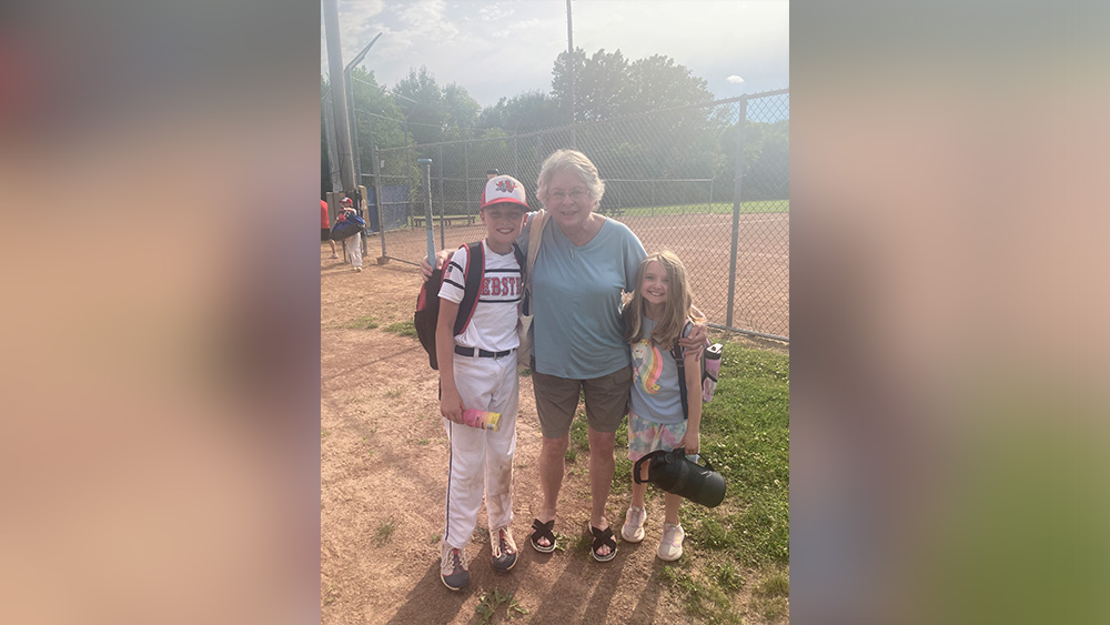 Trish Sevier and grandkids at baseball game