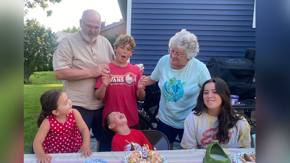 Trish Sevier and husband with grandchildren