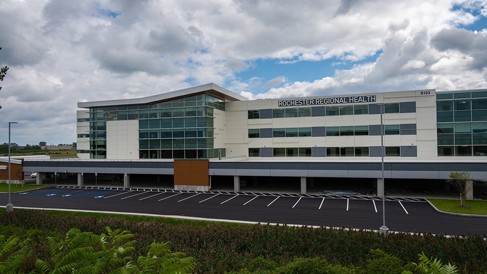 exterior of hospital with cloudy skies