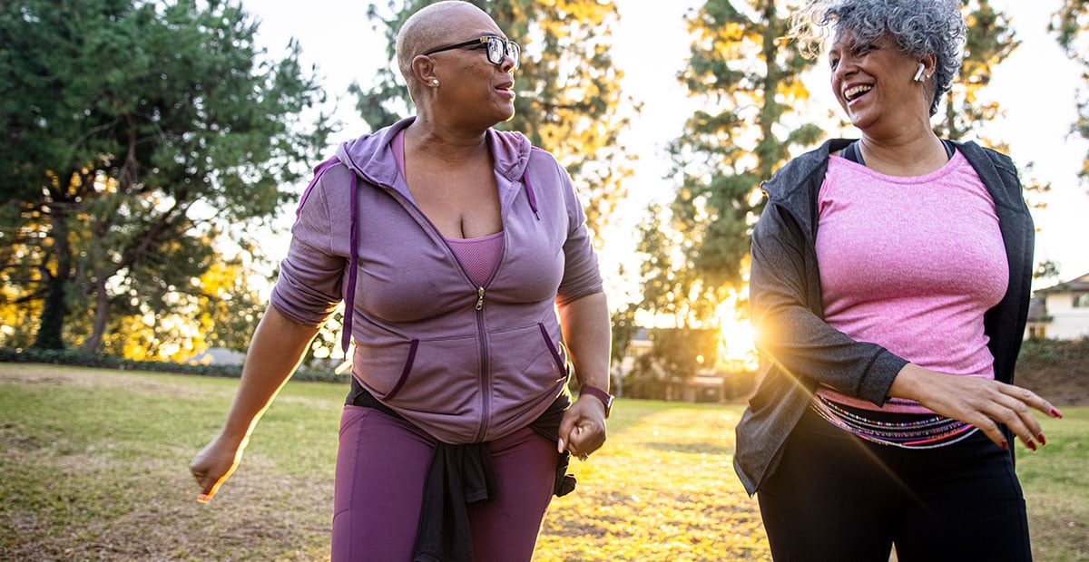 Two mature black women together in nature