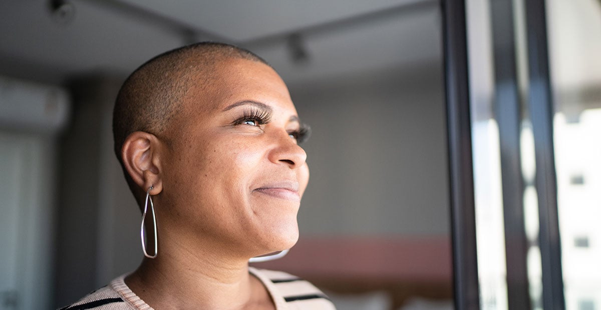 Mature woman contemplating at home