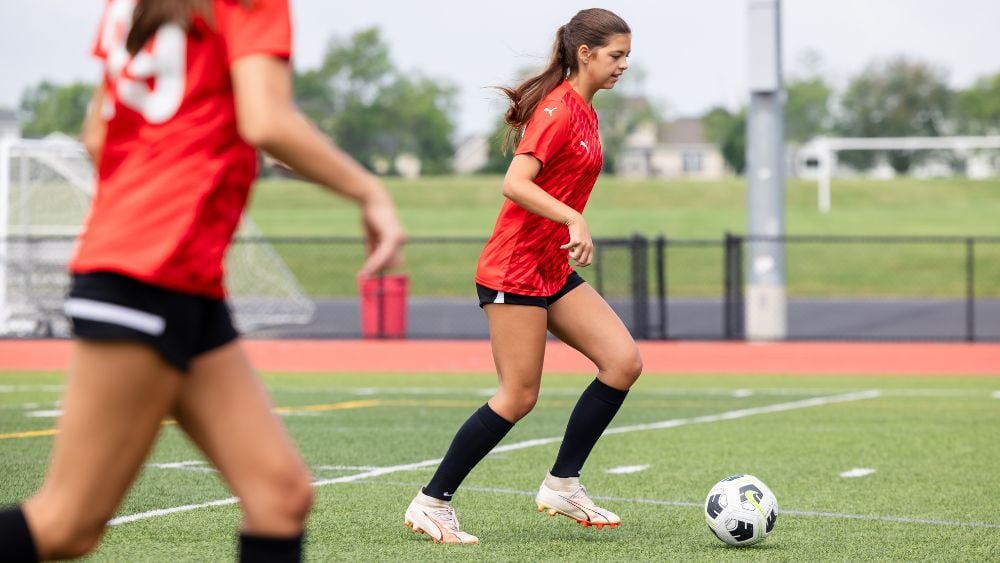 Female soccer players practicing