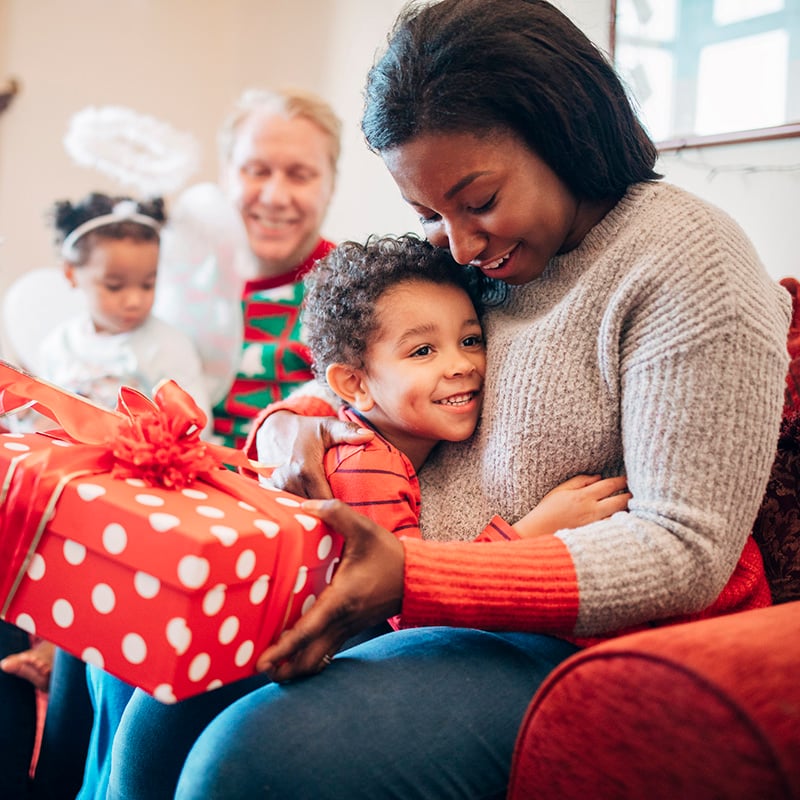 mom and child opening a gift