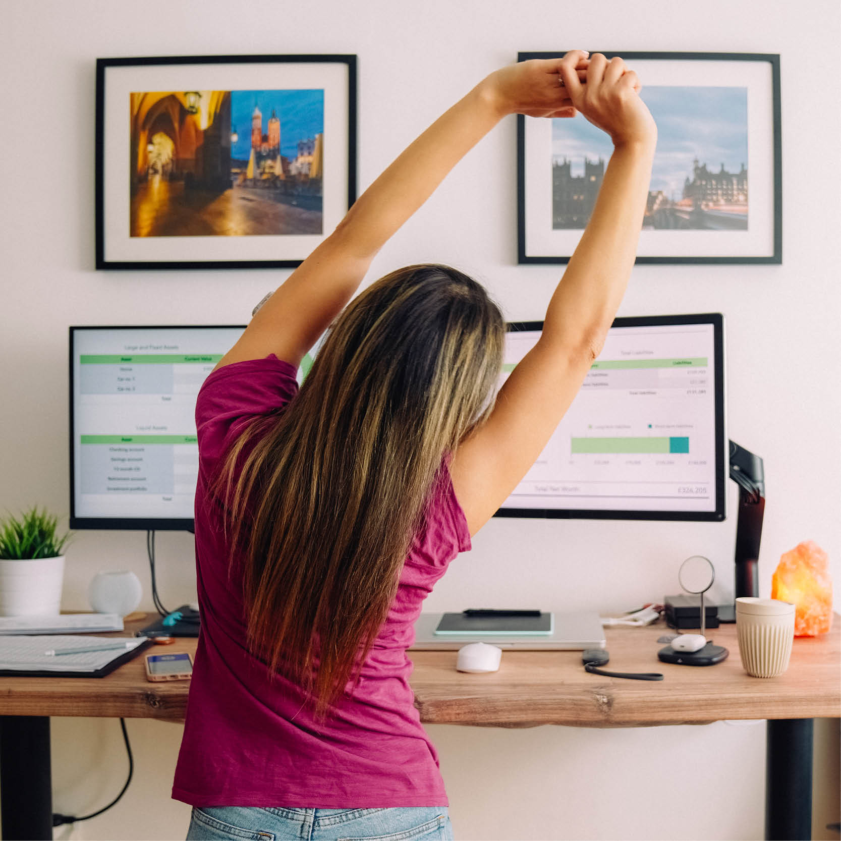 A woman stretches at her home office