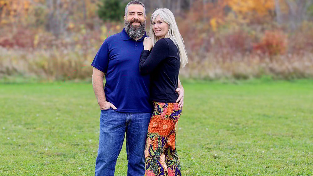 White male and female posing outside in fall season