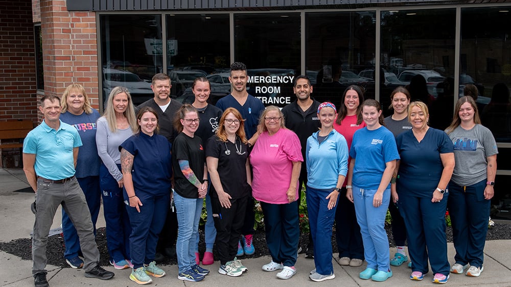 Group photo of emergency medicine providers outside UMMC
