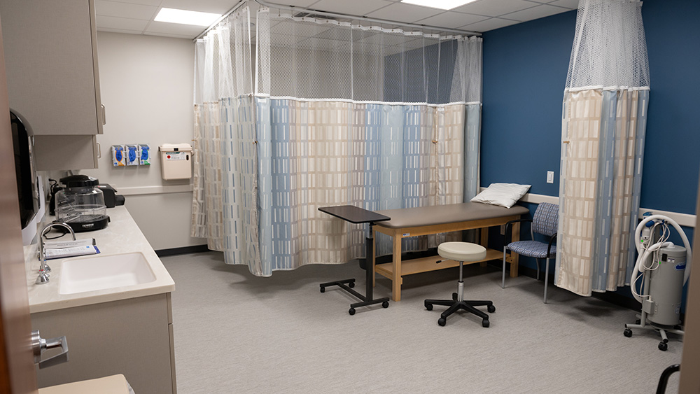 Patient room with separating curtain bed medical equipment