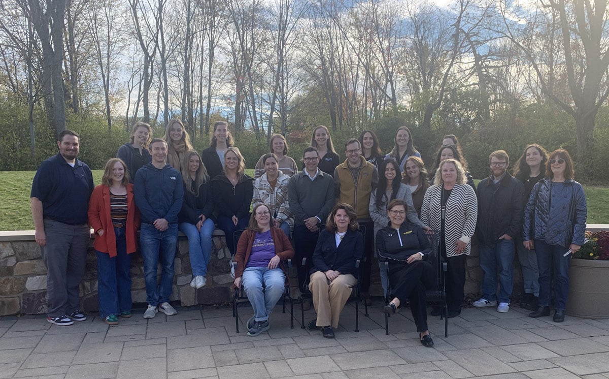 The staff of Foundation posing outside for a group photo