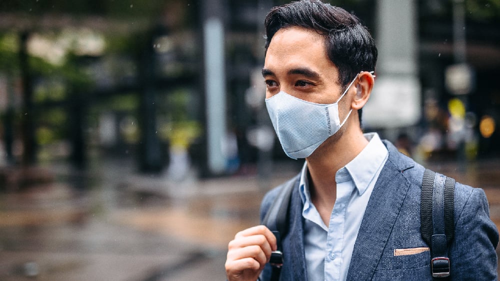 Deaf man wearing face mask