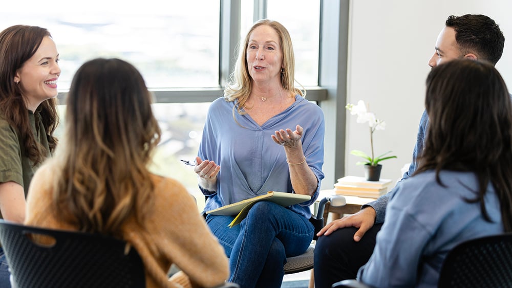 people sitting in a circle for group meeting