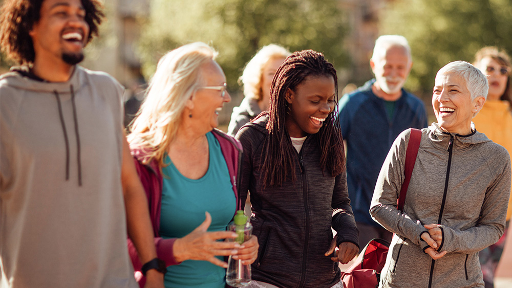 Group of people laugh outside