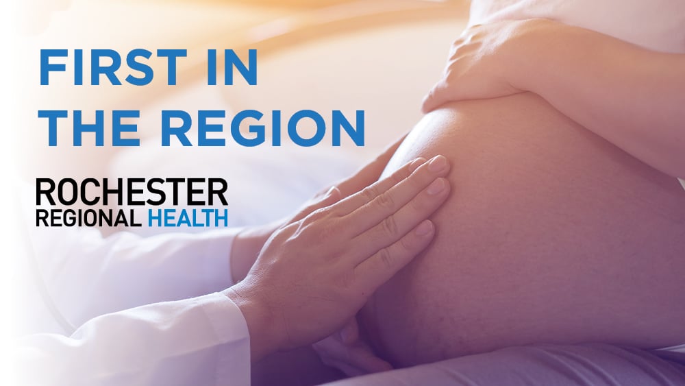 Pregnant woman with doctor's hands