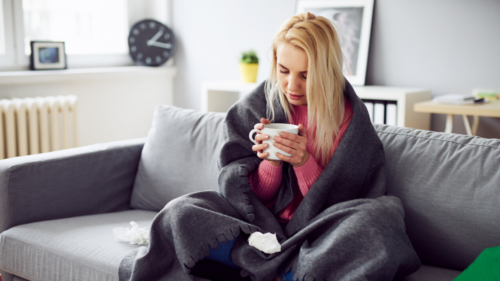 Young woman sick from early flu symptoms