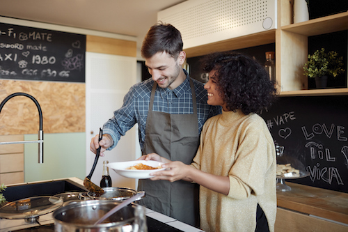 Couple cooking at home