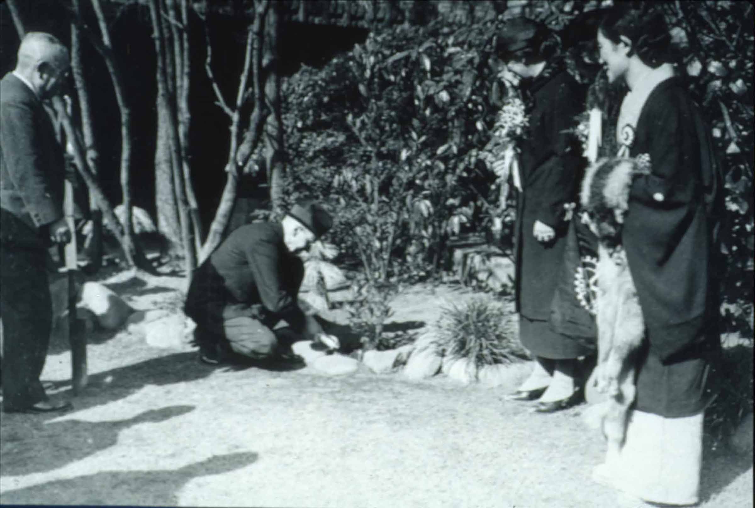 Paul Harris plants a tree in Tokyo as Jean Harris and others look on,1935.