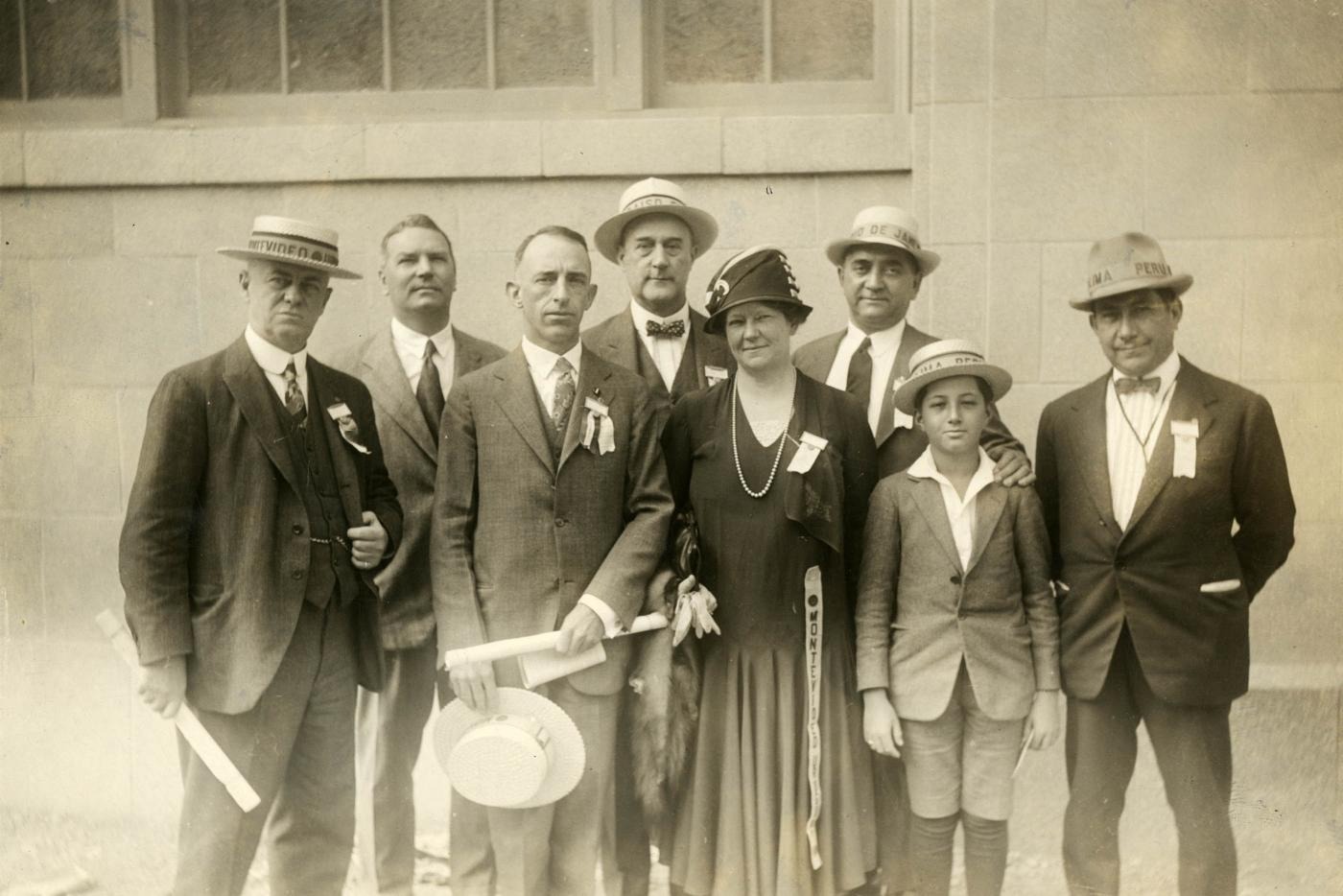 Black and white image of Herbert P. Coates, far left, of Montevideo, Uruguay, 1942-43 Rotary International President Fernando Carbajal, far right, of Lima, Peru, and other attendees at the 1926 Rotary International Convention in Denver, Colorado, USA.