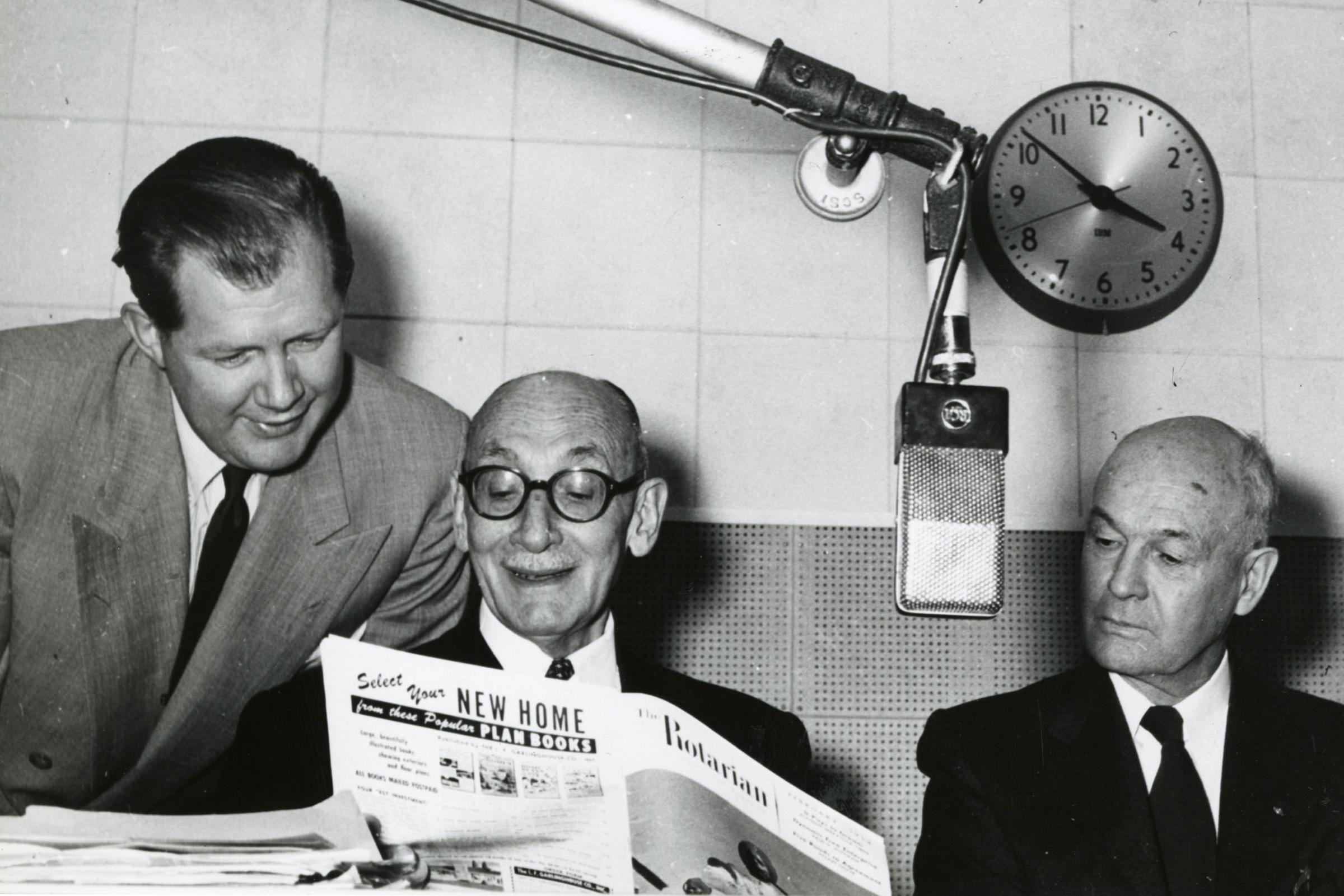 South America has been home to six presidents of Rotary International. In this photo, 1953-54 RI President Joaquin Serratosa Cibils of Montevideo, Uruguay (center), reads The Rotarian during a radio broadcast on WTOP in Washington, D.C. 1954.