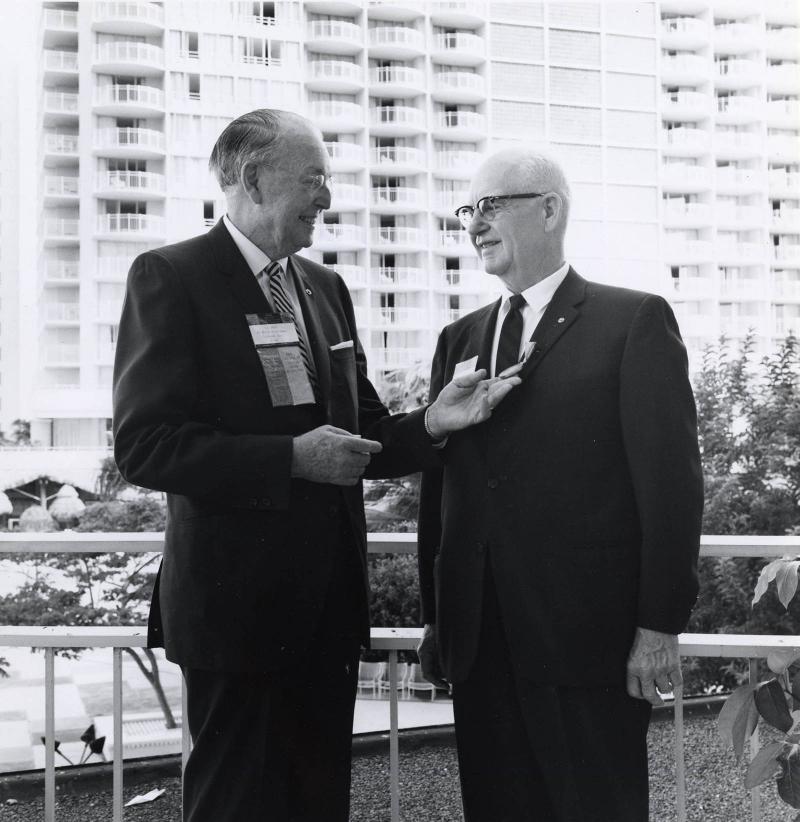 1955-56 RI President A.Z. Baker admires a newly minted Paul Harris Fellow medallion at the 1969 Convention in Honolulu, Hawaii, USA.