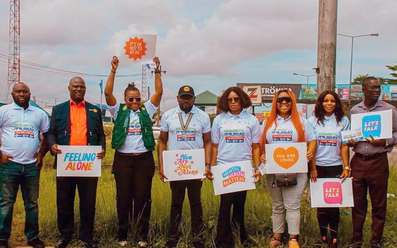 Members of the Rotary Club of Port Harcourt Spring Gardens, Nigeria, gather to unveil a mental health awareness billboard on World Mental Health Day. October 2023.