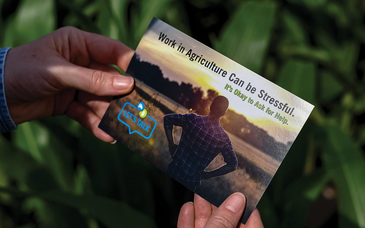 A postcard promoting mental health resources for rural agriculture workers.