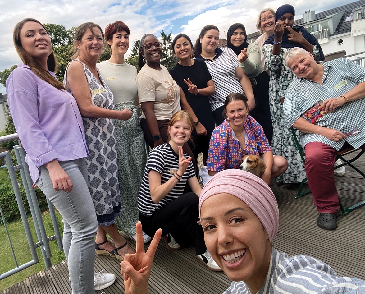 Suaad Abdo (foreground) poses with participants in a computer skills workshop for migrants in Germany that she organized as part of her social change initiative. Courtesy of Suaad Abdo