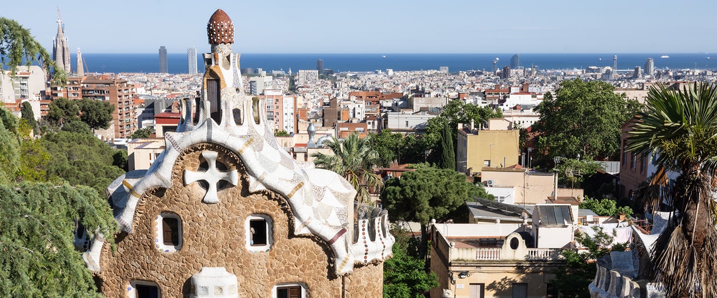 A stone building with an undulating roofline in Barcelona