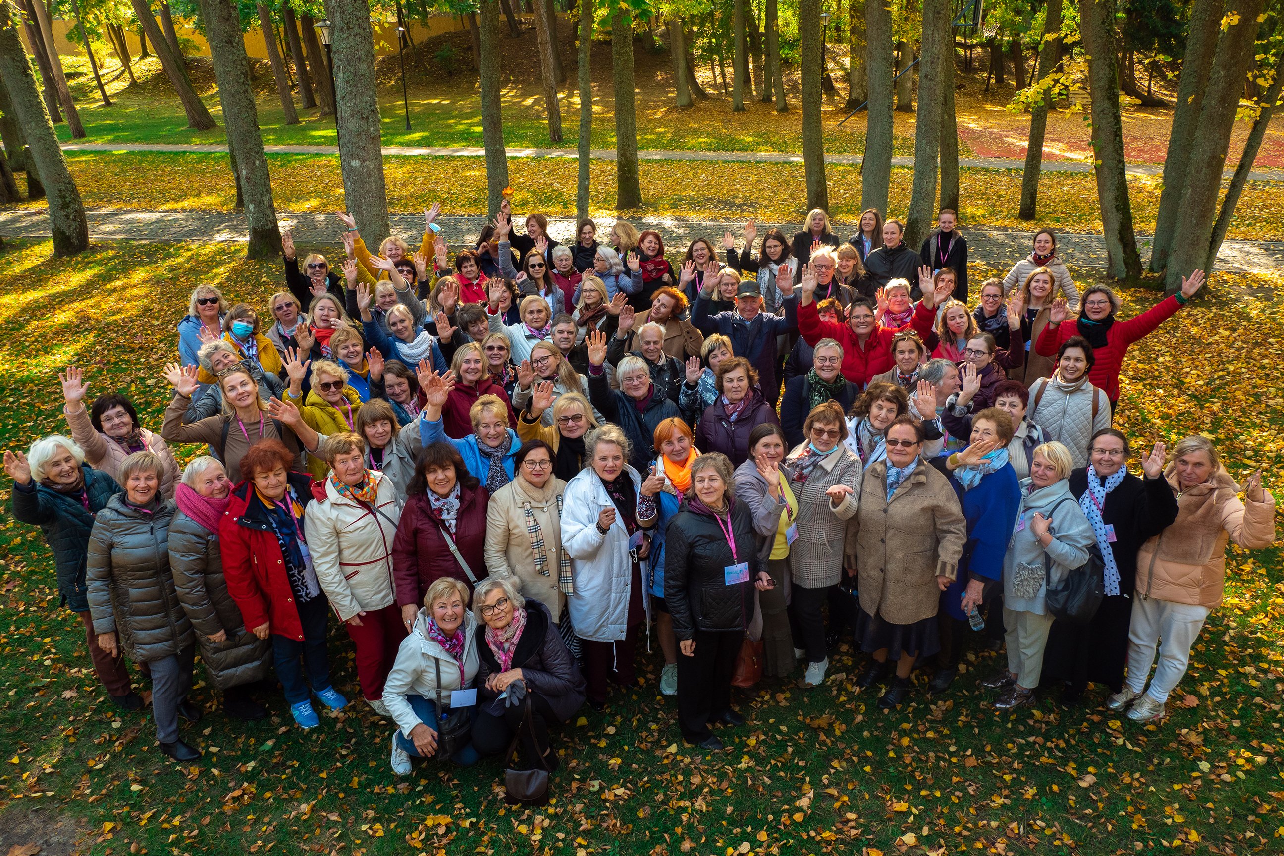 Sidabrinė Linija volunteers gather in a park. The nonprofit has befriended 6,000 older adults since its inception almost a decade ago.