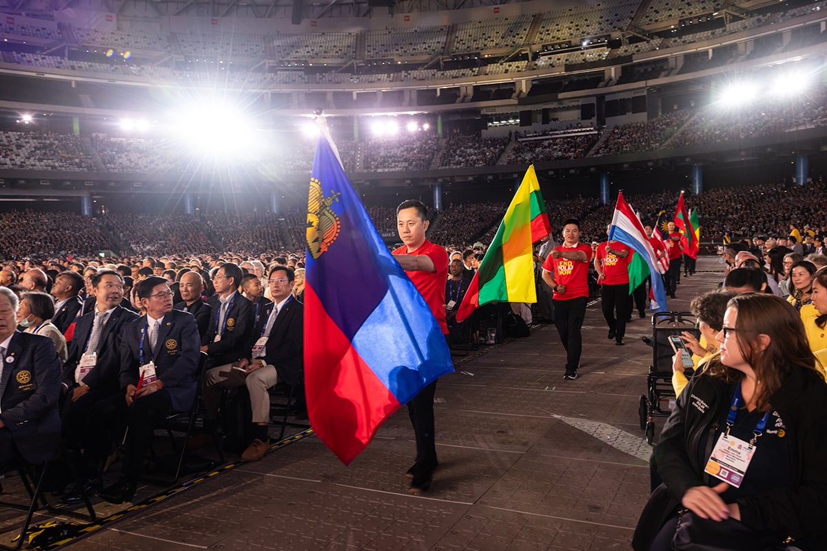 Members from Taiwan participate in the flag ceremony during the opening general session
