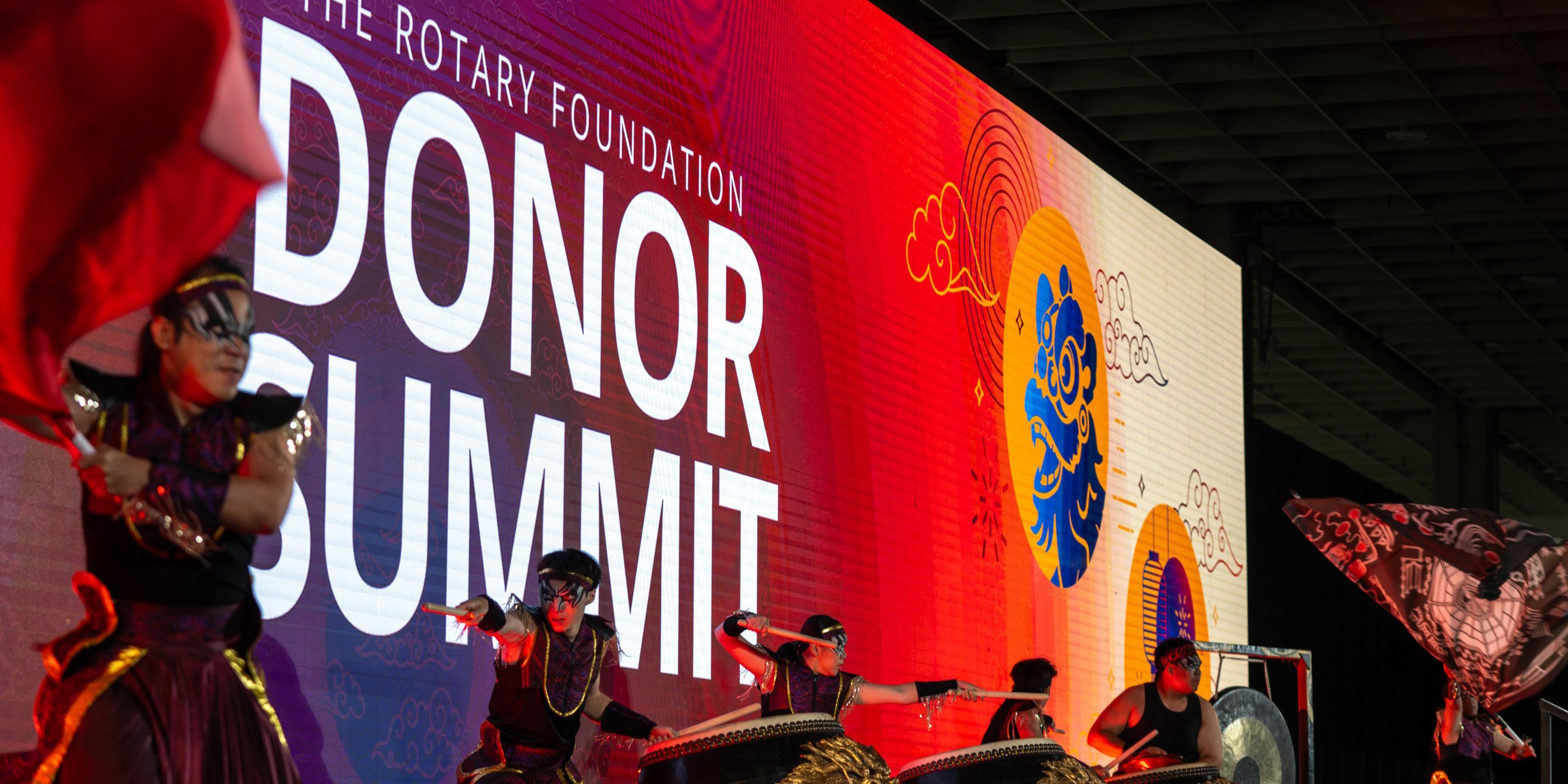 Drummers in traditional clothing perform onstage at The Rotary Foundation Donor Summit in Taipei, Taiwan.
