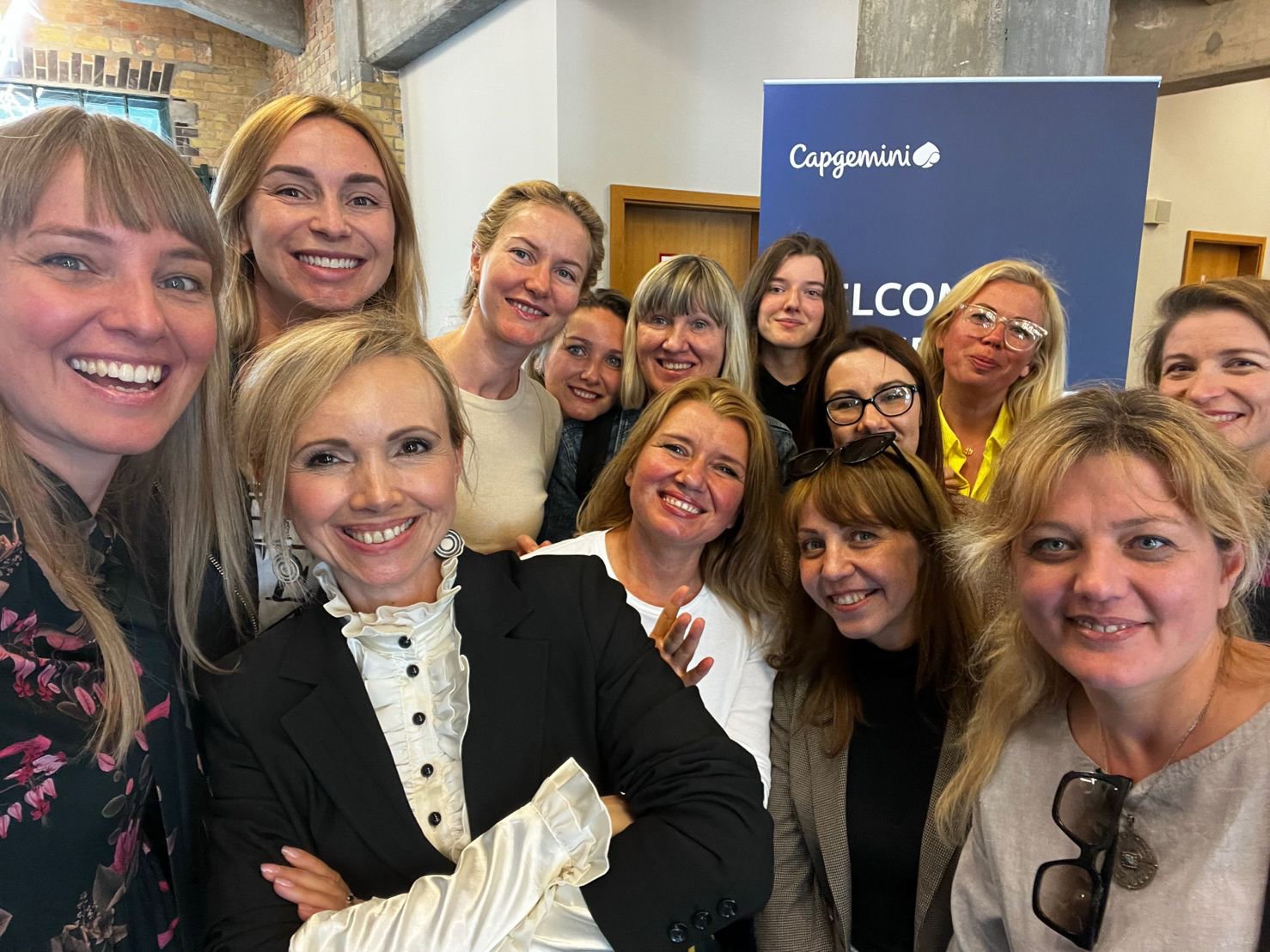 Anne and the founder of ReDI School of Digital Integration post with ReDI School learners from Ukraine.