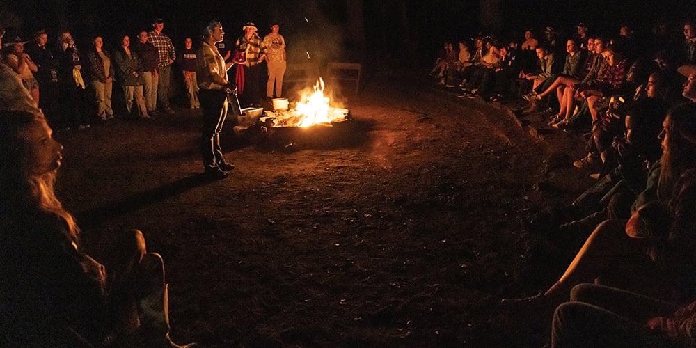 People surrounding a campfire