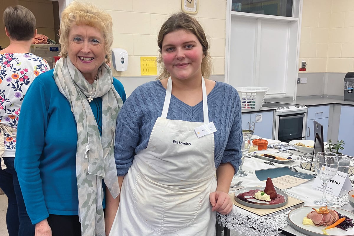 Glenys Robertson poses with a young chef 
