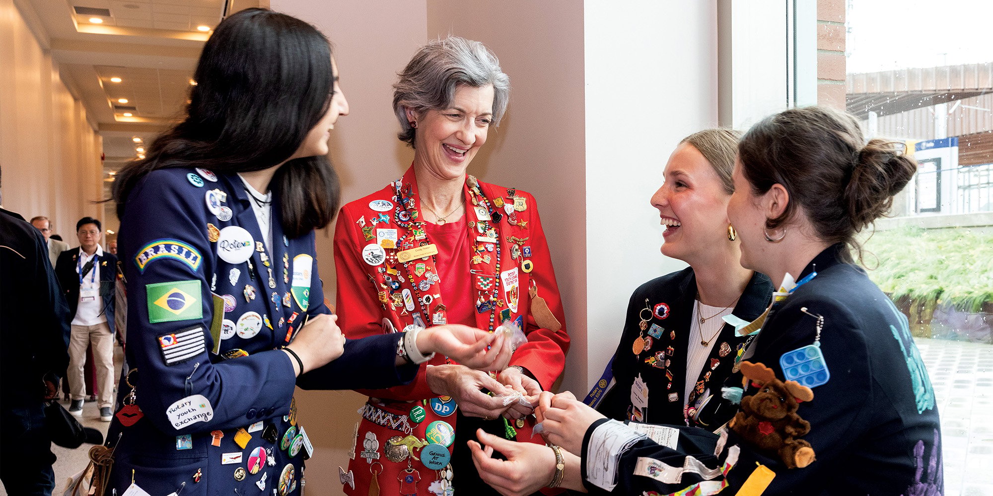 A group of female Rotary members gather to talk
