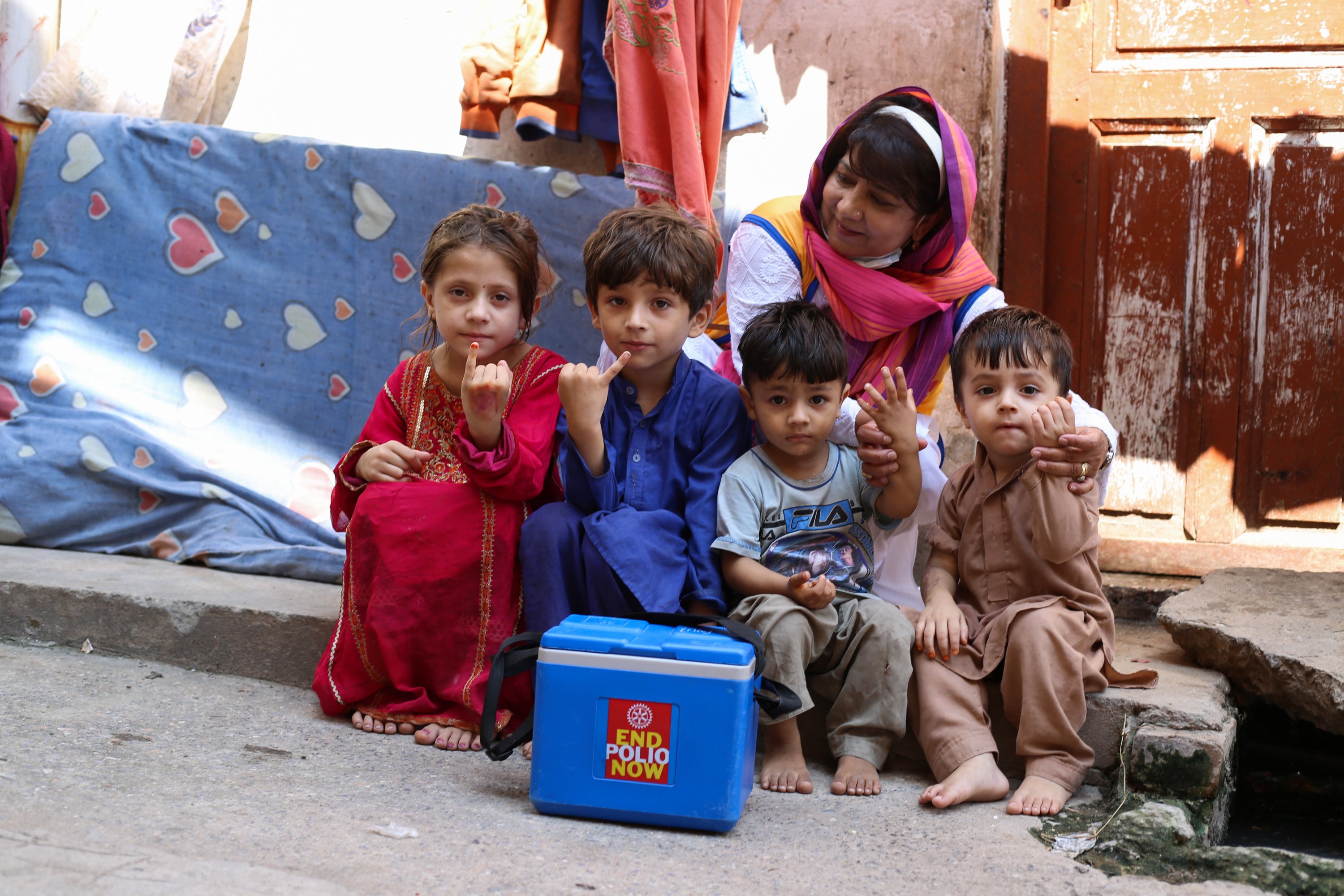 Tayyaba Gul of the Rotary Club of Islamabad (Metropolitan) with children who were immunized during a national immunization day in Rawalpindi, Punjab, Pakistan.