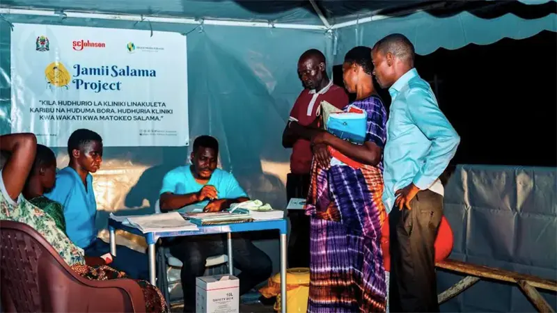 People visiting health clinics build by the community.