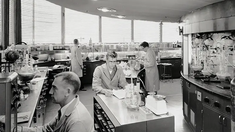 Interior photo of people working in a lab in the SC Johnson Research Tower