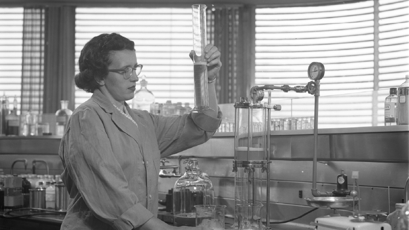 Scientist looking at a beaker
