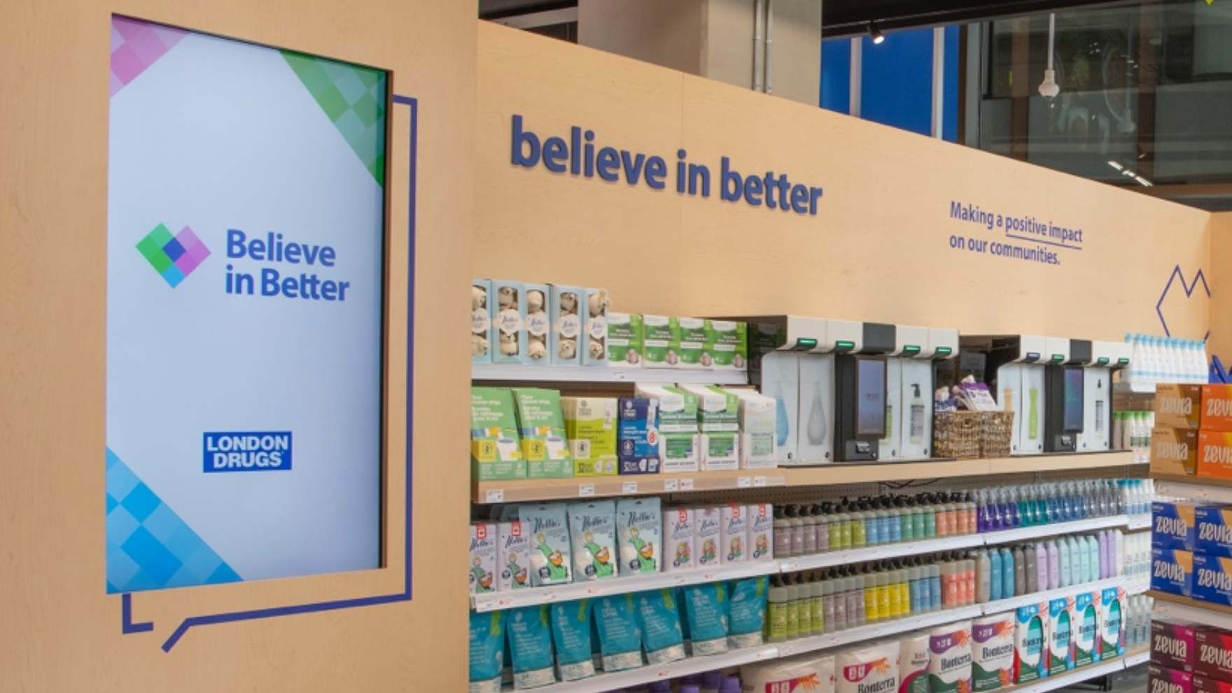Light brown drugstore wall display of soap with refill soap machines on along the display. 