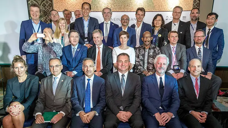 Fisk Johnson on stage with Ellen MacArthur and other delegates at the signing of the New Plastics Economy Global Commitment