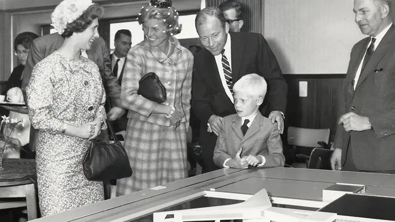 Sam Johnson and family look at an architectural model of Europlant