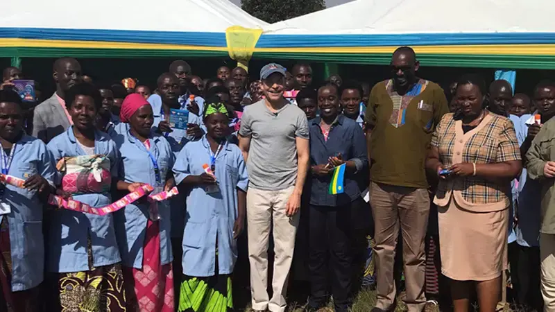 Fisk Johnson with the Rwanda Ministry of Health and people.