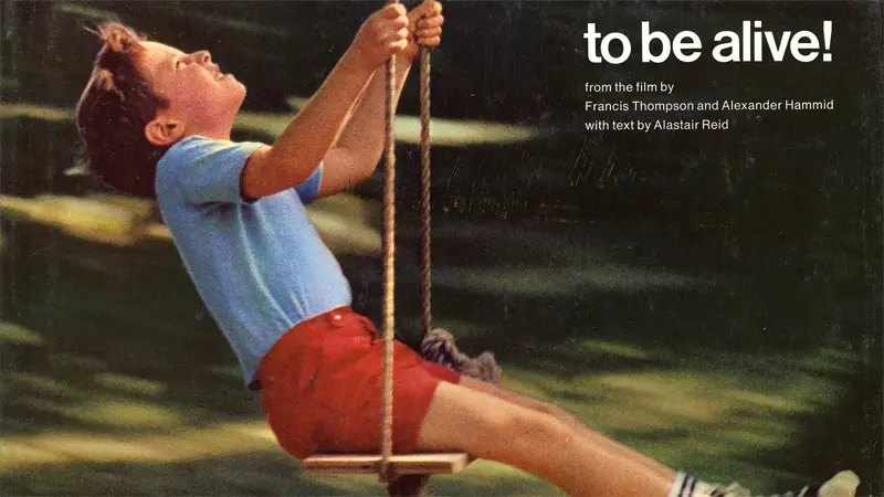 Boy swinging joyfully outdoors; text reads "to be alive!"