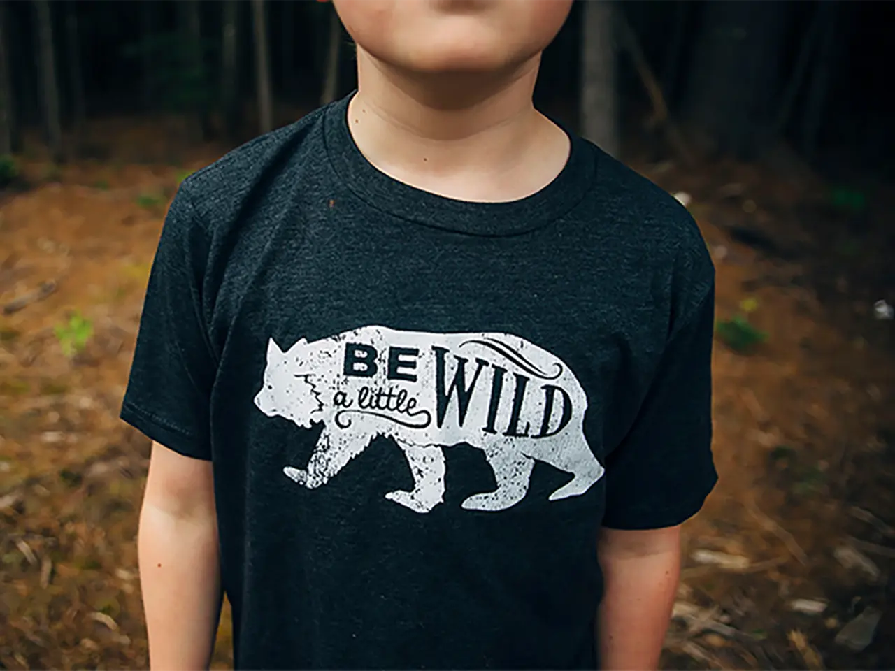 Child wearing dark colored shirt