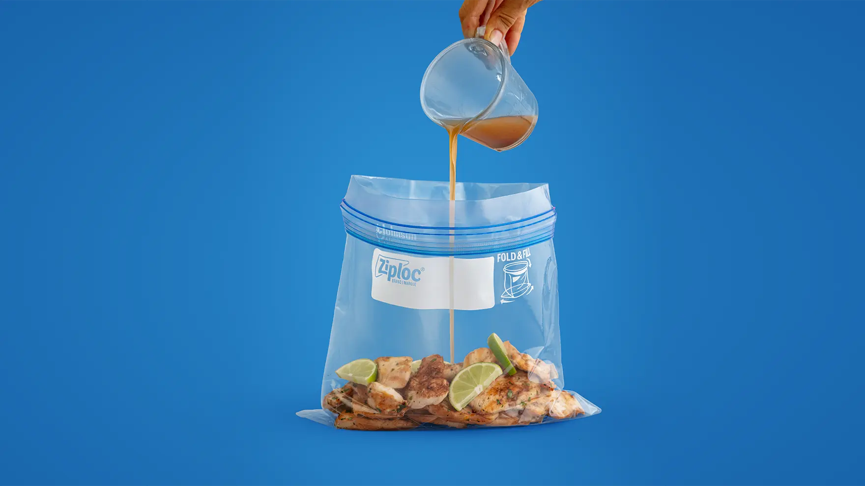 Marinade being poured in Ziploc bag