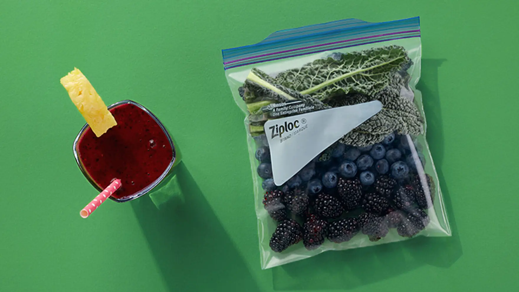 Ziploc bag filled with kale, blueberries, and blackberries