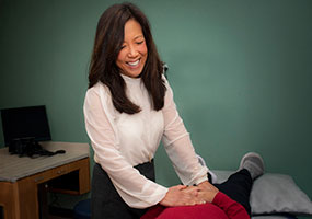 provider examines patient lying on exam table