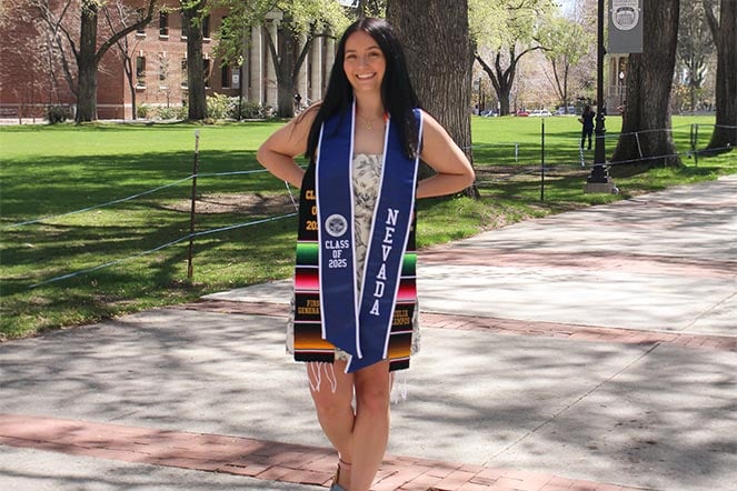 female scoliosis patient wearing graduation attire