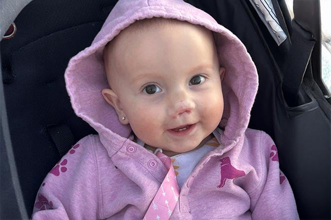 a baby in a sweatshirt