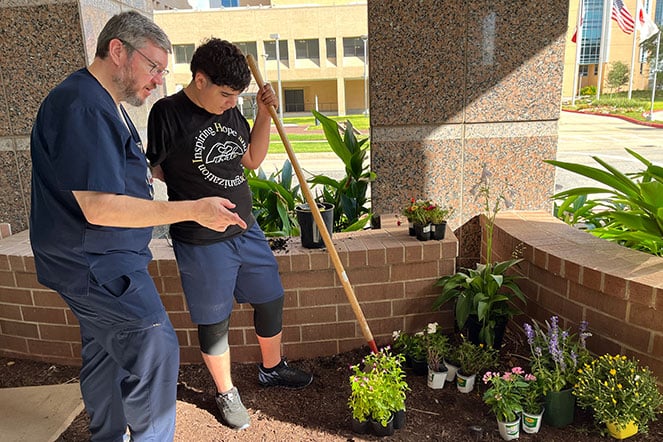 patient and provider outside gardening